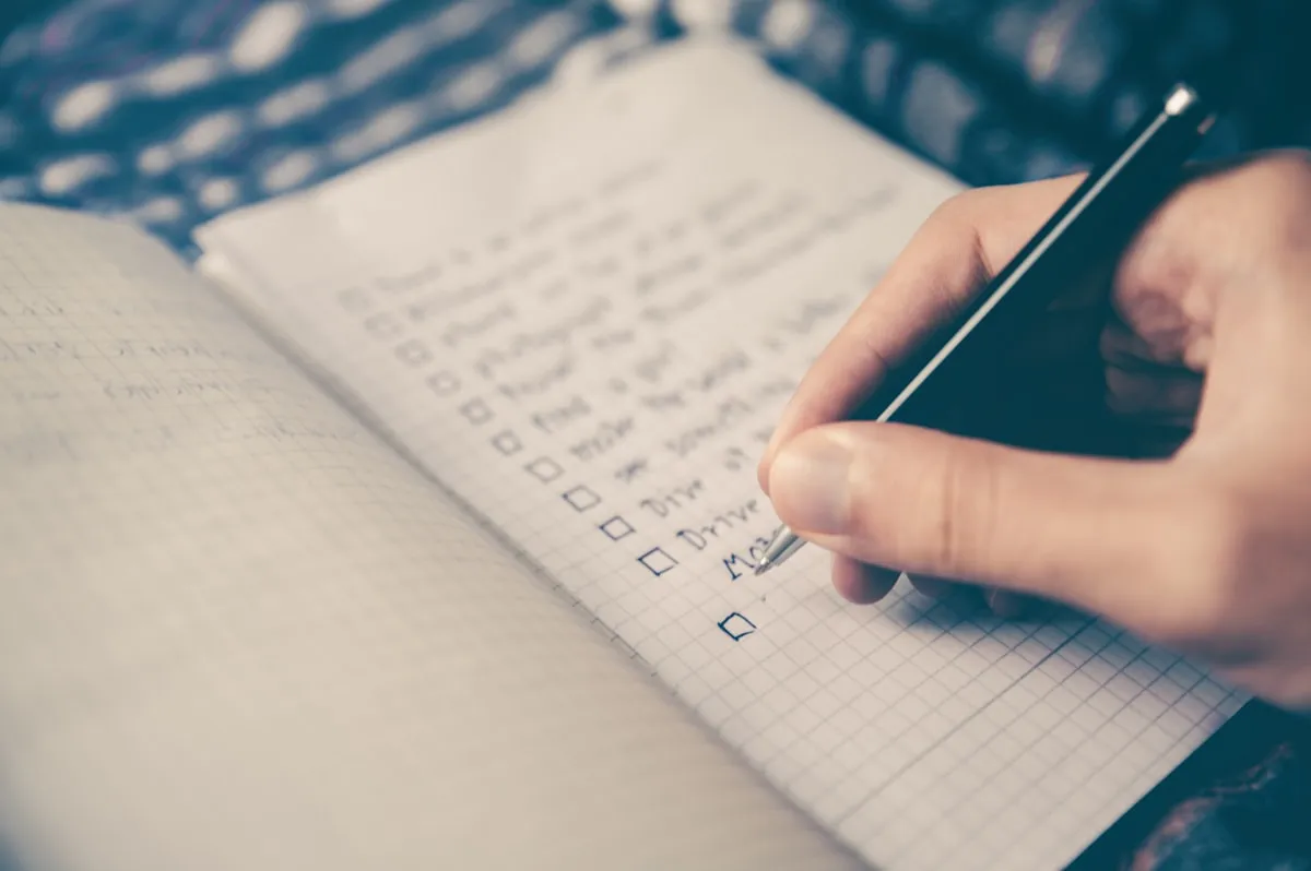 Budget planning notepad with peso calculations
