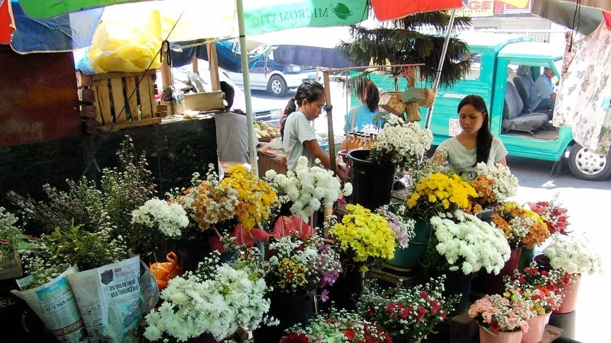 Davao City public market scene with vendor stalls along Matina street and pedestrian foot traffic