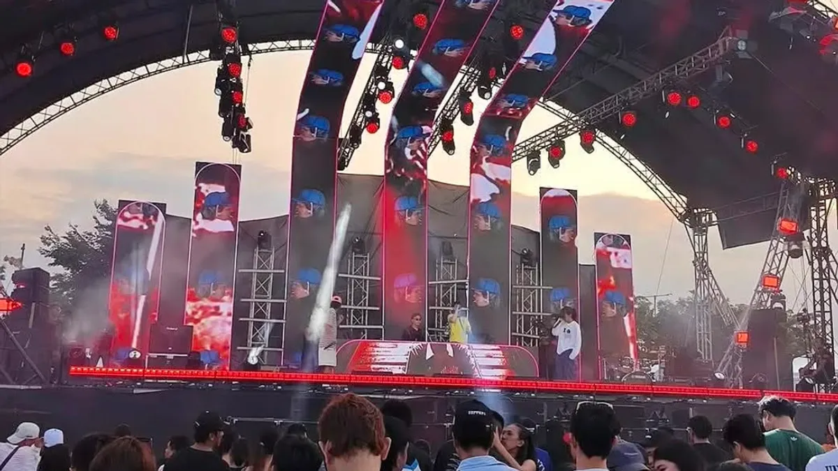 Concert stage with LED screens at an open-air township venue