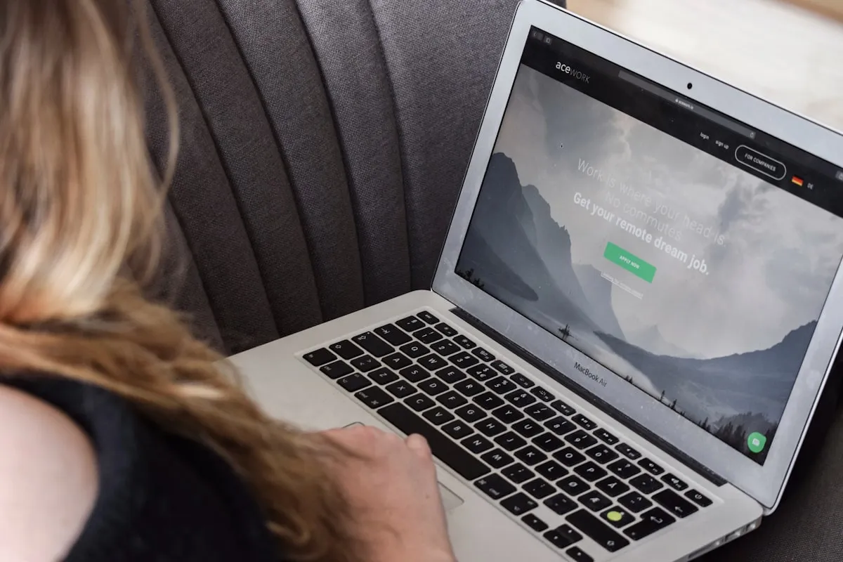 Remote worker using a laptop on a couch
