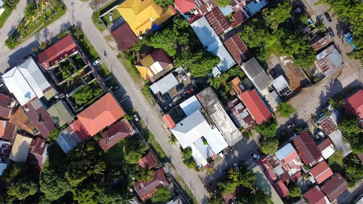 Aerial view of a Davao residential neighborhood with mixed-roof single-detached houses on a subdivision street
