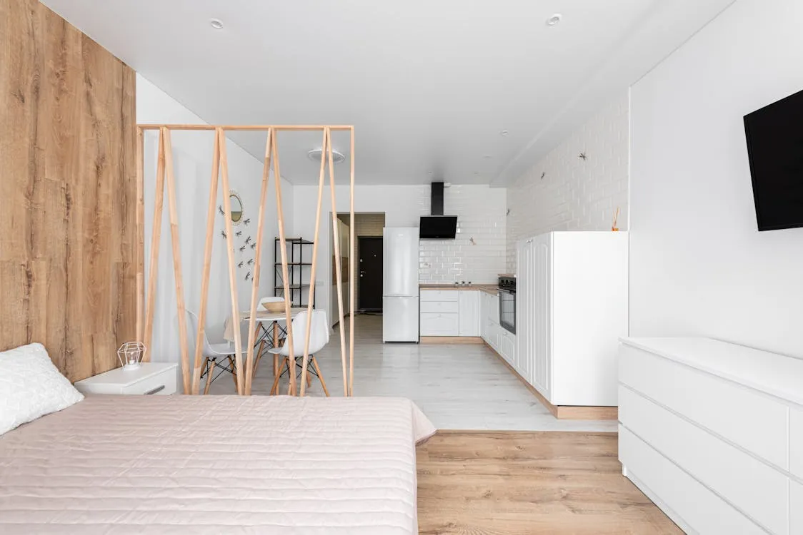 Modern apartment bedroom with desk area