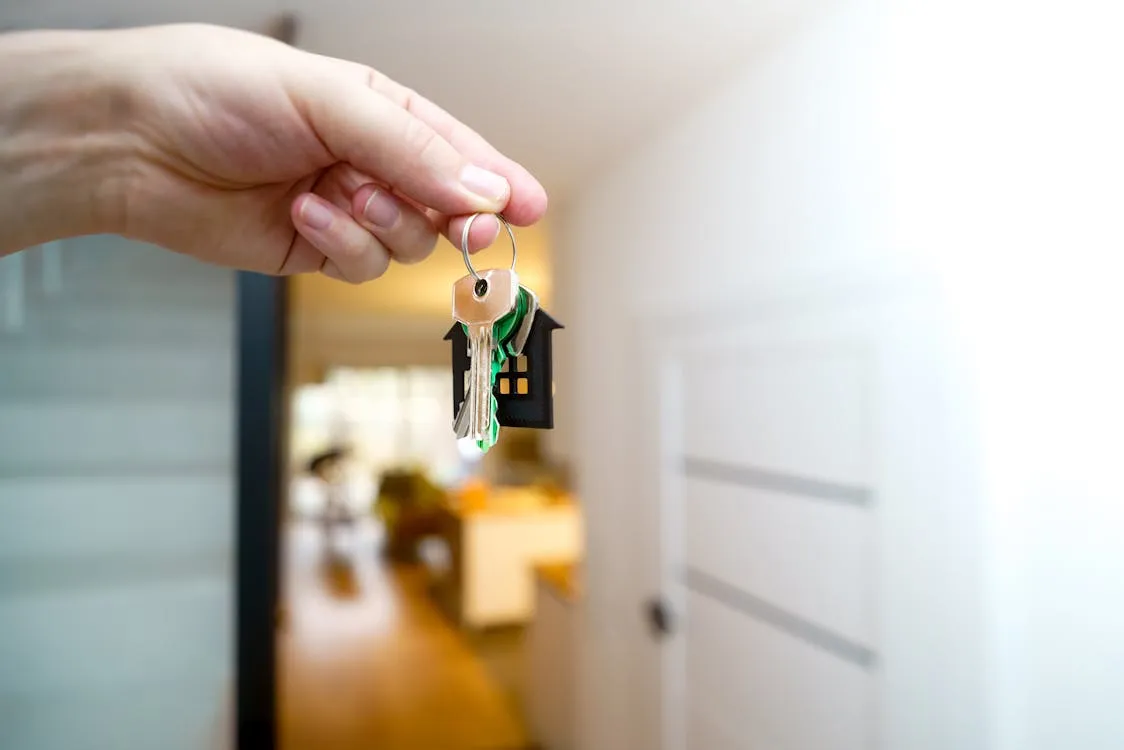 Real estate agent handing over keys to a new tenant