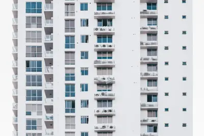 Multi-storey residential building with AC units typical of boarding house areas