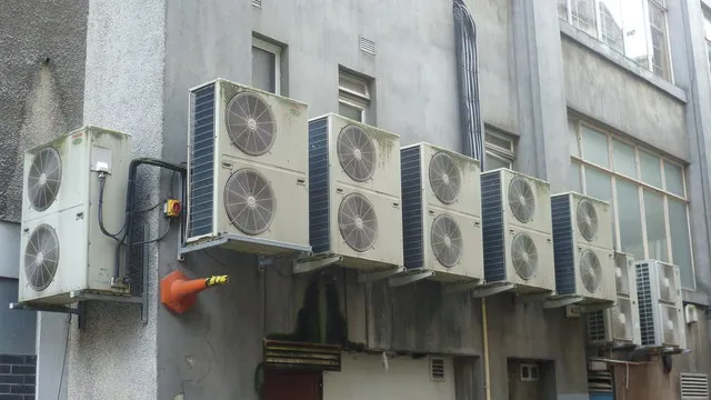 Row of air conditioning outdoor units on a Davao apartment building